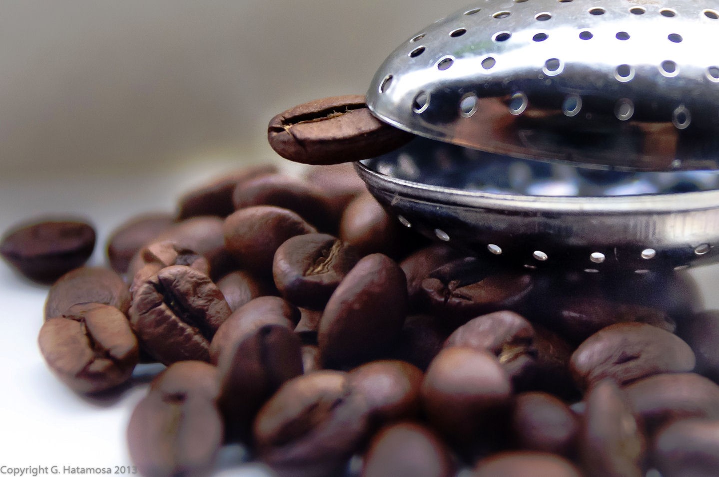 Silver Tea Kettle Next to Coffee Beans