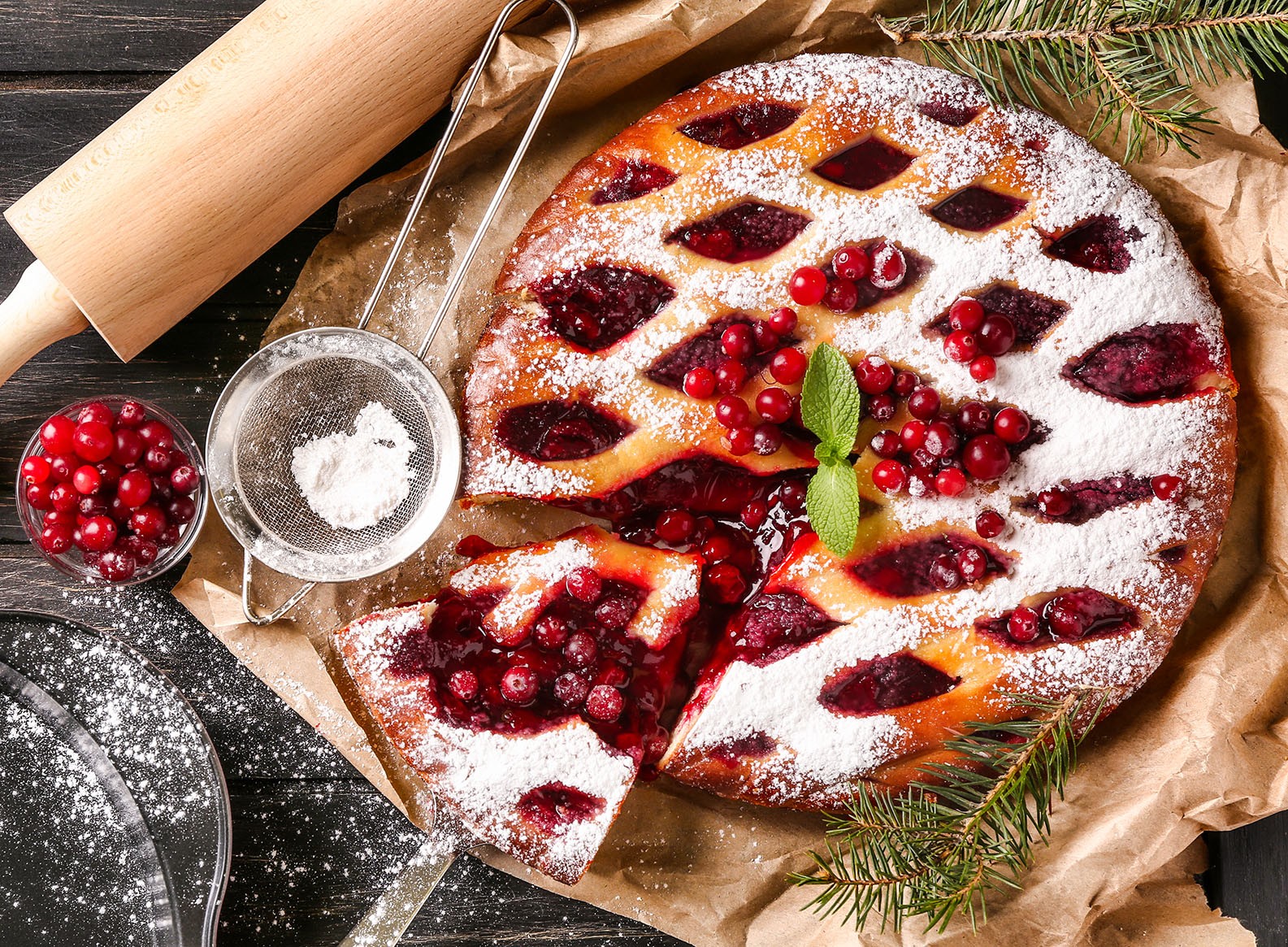 Delicious dessert, red berries, sugar powder on cake