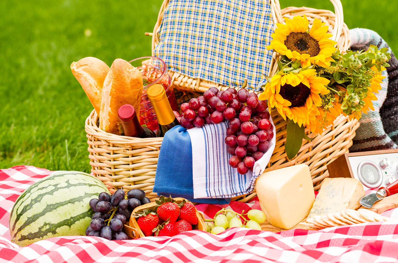Picnic basket on tablecloth