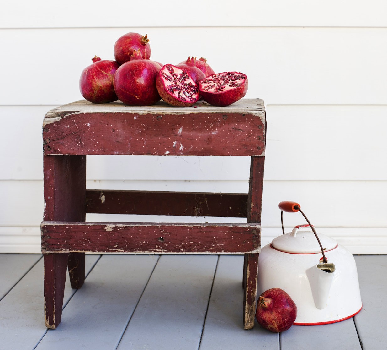 Colorful Pomegranates on Wooden Table