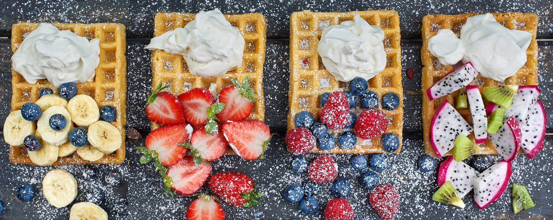 Strawberries, bananas, blueberries and whipped cream waffles