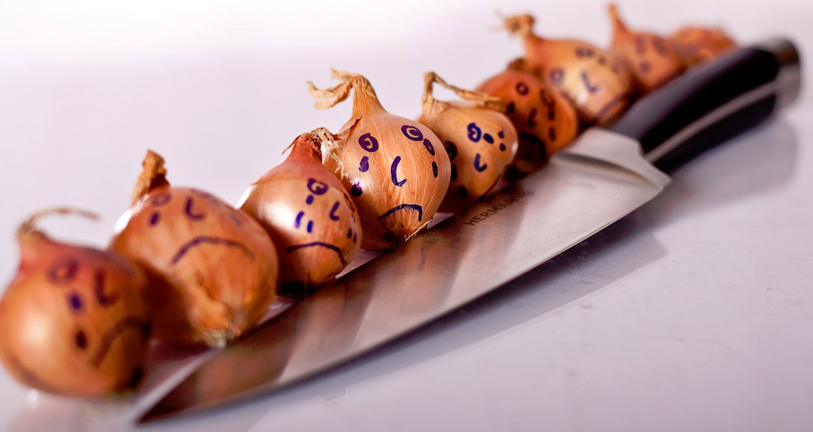 Onion faces with knives