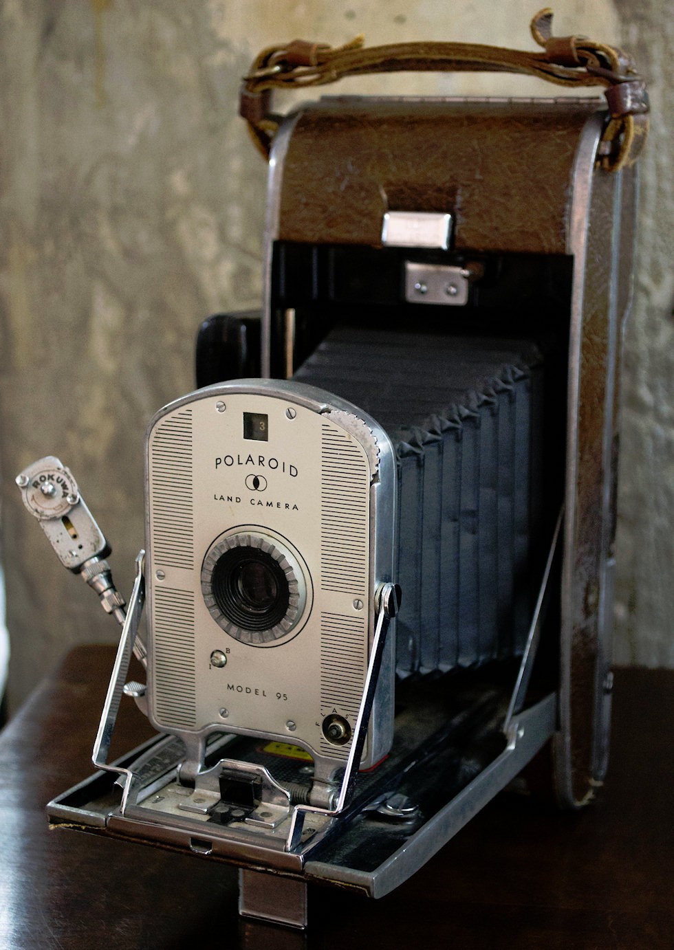 Antique camera on wooden table