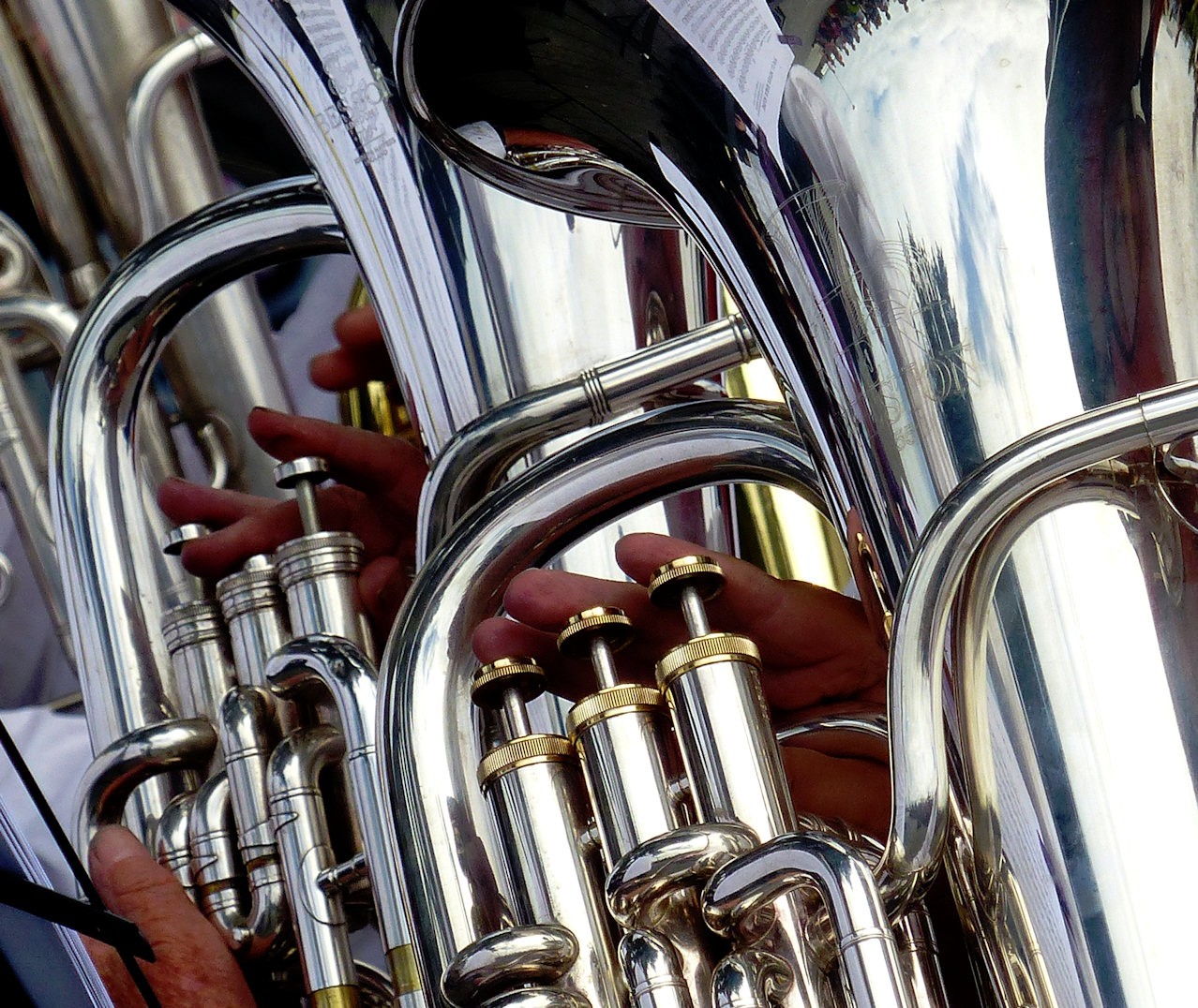 The tuba is silver