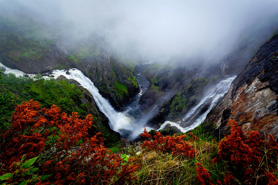 Waterfall surrounded by fog