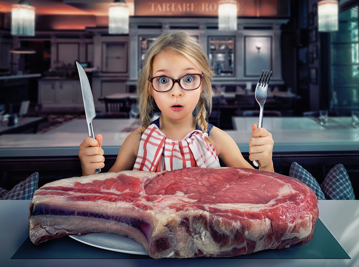 Girl holding knife with meat