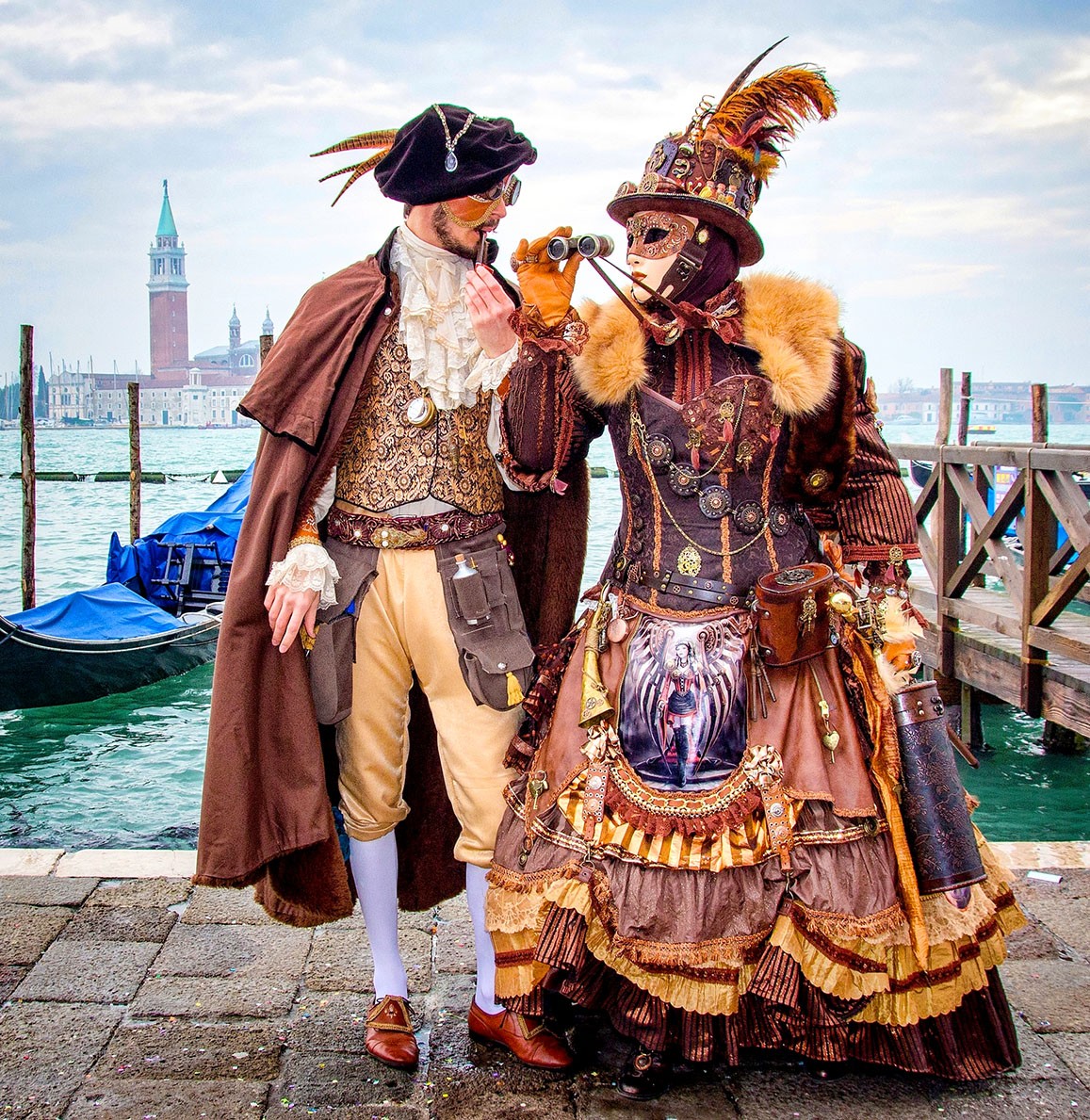Costumed couple at water