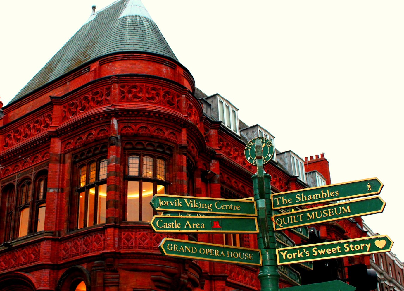 Tall red building with signs