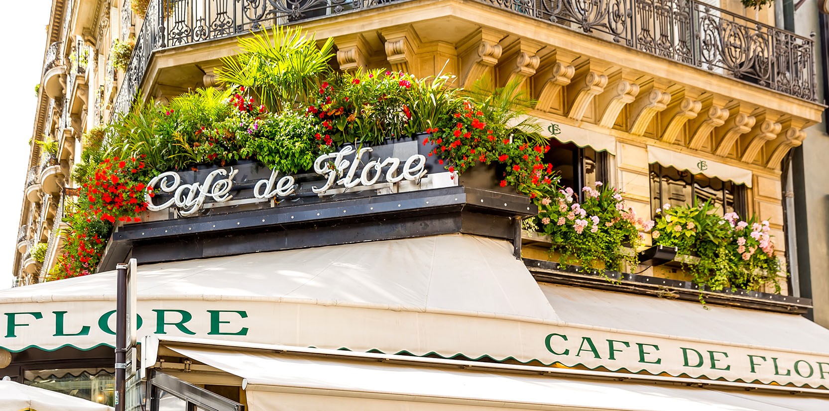 Floral balcony, cafe on left
