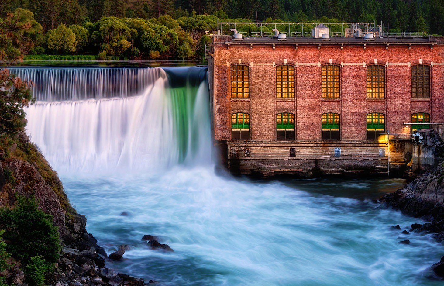 Waterfall near brick building