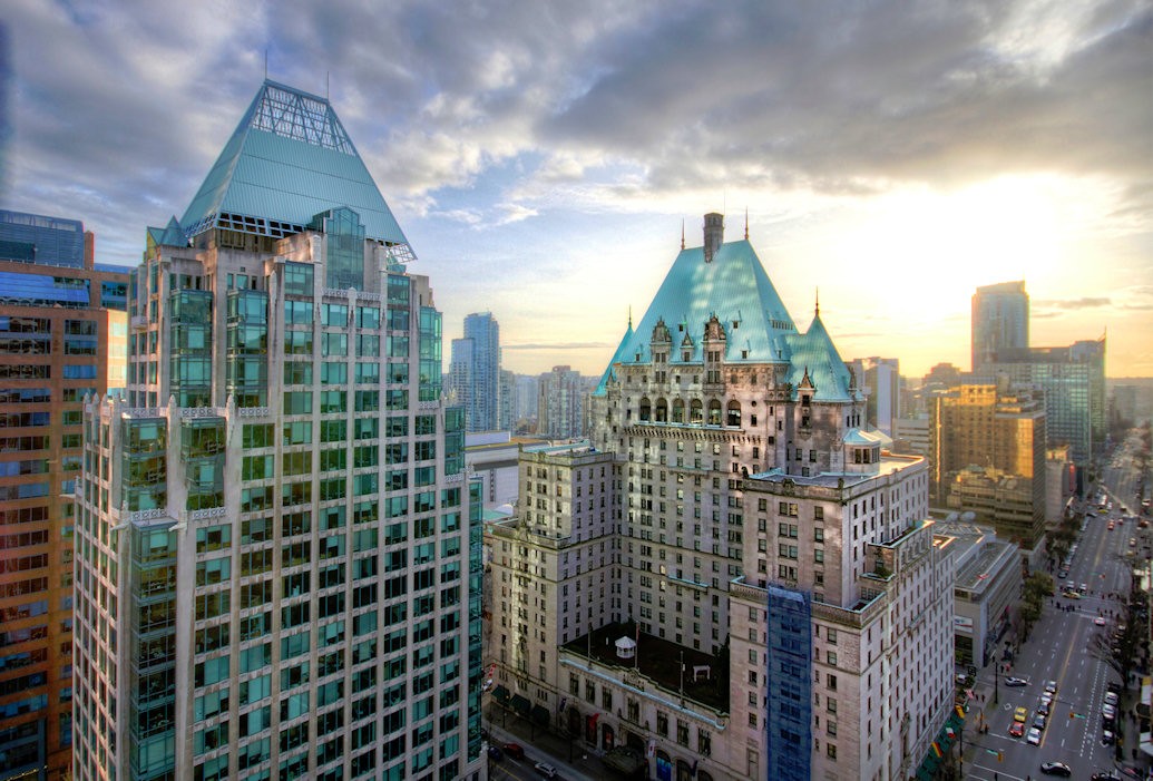 City skyline from above, modern building in foreground, skyscraper, tall building, urban architecture, high rise